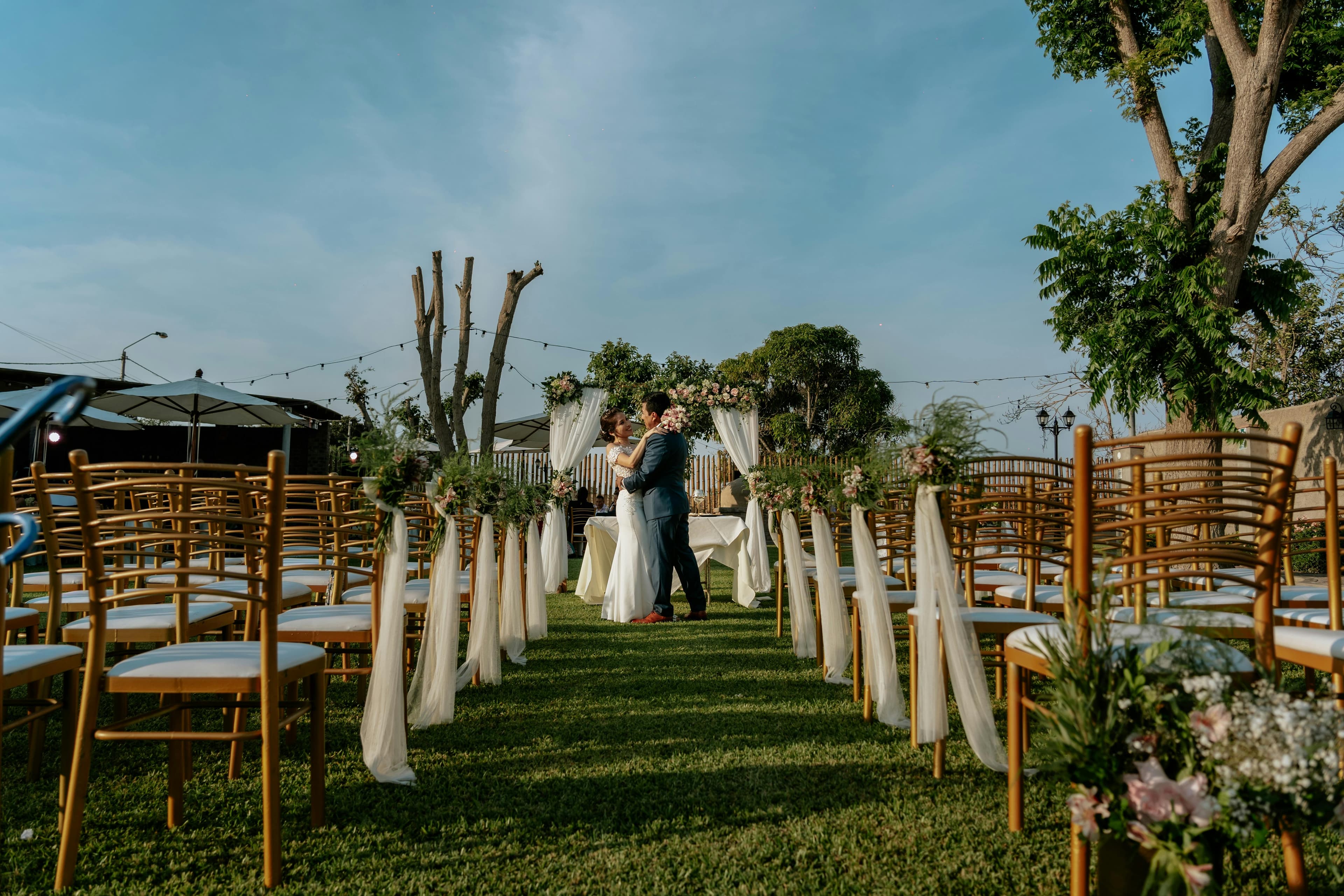 Outdoor wedding ceremony with floral arch